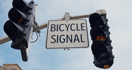 Bicycle sign coupled with a cyclist-specific signal light underscores the cities commitment to safe...