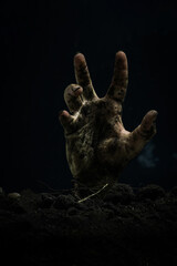Zombie hand on black background. Halloween concept. Horror film.