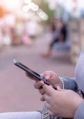 Women using smart phone mobile on soft background