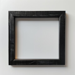 Obraz premium Black textured picture frame on white wall.