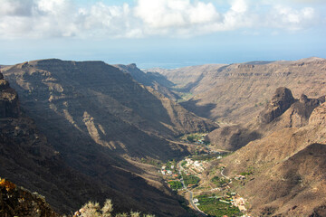 Fototapeta premium Mountains with a small village in the valley