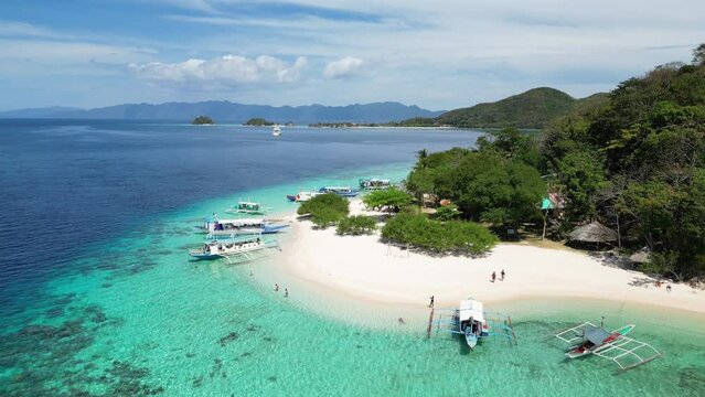 Aerial view of tropical island with white sand beach and turquoise water