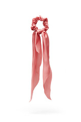 Close-up shot of a pink hair scarf scrunchie. Women's satin bow scrunchie is isolated on white background. Front view.