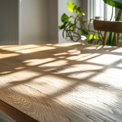 An empty wooden table with shadows of a plant on it. - obrazy, fototapety, plakaty