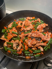 Pork and vegetable stir fry in the pan.