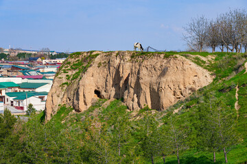 Afrosiyab Hill as seen from the Khoja Doniyor (Saint Daniel) Mausoleum in Samarkand, Uzbekistan - Grassy hill that was the site of a Sogdian city