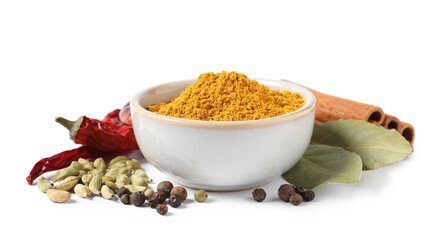 Curry powder in bowl and other spices isolated on white