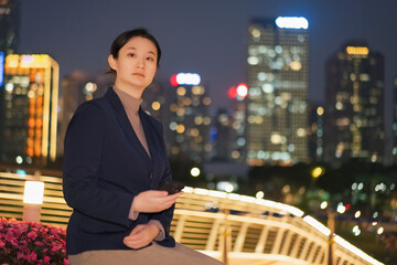 Professional Woman Contemplating in City at Night