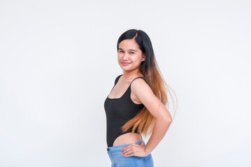 Young Asian woman in a casual black bodysuit posing confidently, isolated on a white background