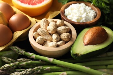 Nuts, cottage cheese, asparagus and other healthy food, closeup