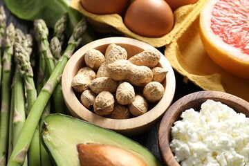 Nuts, cottage cheese, asparagus and other healthy food, closeup
