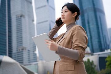 Confident Businesswoman Communicating in Urban Environment