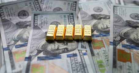 group gold bars and paper dollar bills as financial background