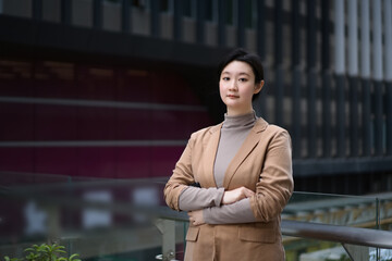 Confident Businesswoman in Stylish Work Attire Outside Office