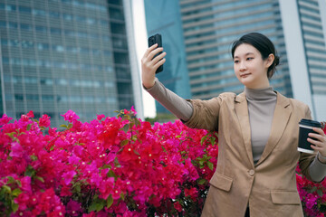 Professional Woman Captures Selfie by City Blooms