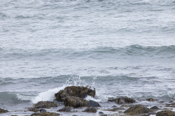 Ocean waves crashing on a rocky shore