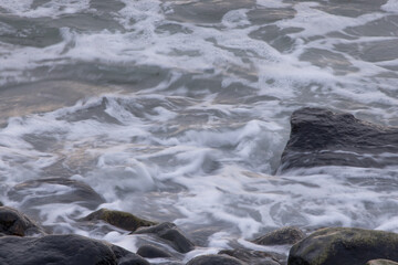 Ocean waves crashing on a rocky shore