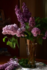 lilac flowers in vase on a table