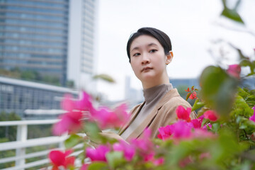 Young Woman Contemplating Nature in the City