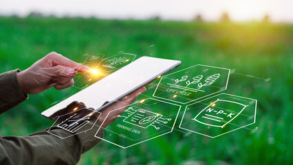 Farmers use agricultural technology in data analysis tablets and image icons. New technologies in agricultural business concepts. Men use tablets to research and develop plant varieties, agricultural 