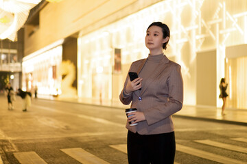 Confident Woman Texting on Smartphone in Urban Setting