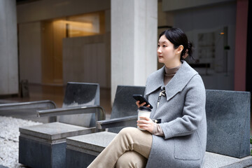 Young Professional Woman Taking a Break Outside