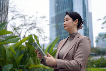 Professional Businesswoman Using Tablet in Urban Setting