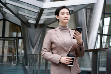 Professional Businesswoman Using Smartphone on Break