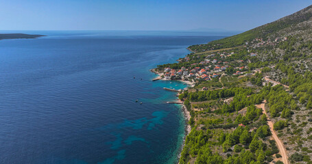 AERIAL: Flying along the Mediterranean coastline and a sleepy oceanfront village