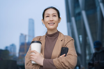 Confident Young Woman Enjoying City Life with Coffee