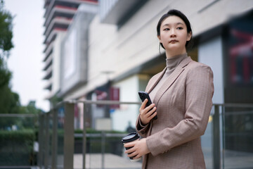 Confident Businesswoman on Coffee Break Outdoors