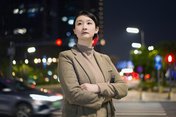 Confident Young Woman in Urban Night Setting
