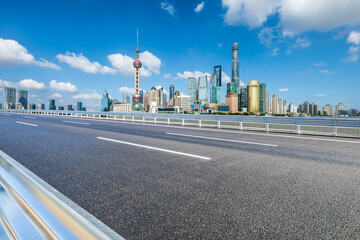 Asphalt highway road with modern city commercial buildings scenery in Shanghai. Famous city...