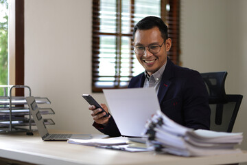 Executive businessman working on documents in office.