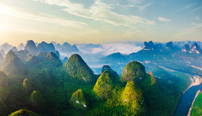 Aerial view of the beautiful karst mountains and sky clouds natural landscape at sunrise in Guilin, China. Famous mountain landscape in summer.