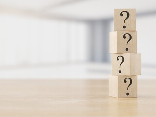 Wooden cubes with question marks. FAQ concept