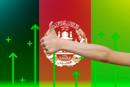 Afghanistan flag with green up arrows, country statistics concept,  finger thumbs up front  - Powered by Adobe