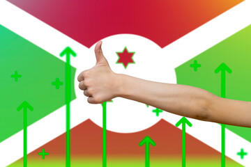 Burundi flag with green up arrows, country statistics concept,  finger thumbs up front of Burundi 