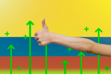 Colombia flag with green up arrows, country statistics concept,  finger thumbs up front of Colombia 