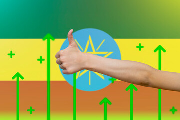 Ethiopia flag with green up arrows, increasing values and improving economy,  finger thumbs up 