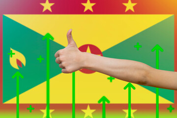 Grenada flag with green up arrows,  finger thumbs up front of Grenada flag, country statistics 