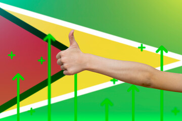 Guyana flag with green up arrows, country statistics concept, increasing values and improving 