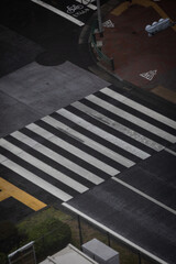 An empty road crossing seen from above.