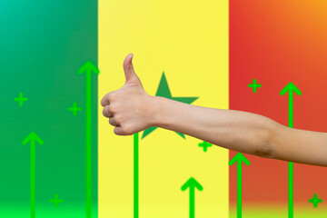Senegal flag with green up arrows,  finger thumbs up front of Senegal flag, increasing values and 