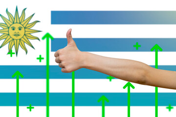 Uruguay flag with green up arrows, increasing values and improving economy,  finger thumbs up front 