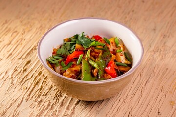 Stir-Fried Vegetable and Meat Bowl on Wooden Table