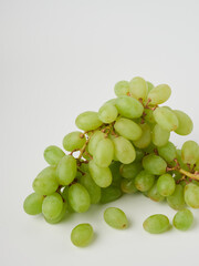 Fresh green grapes with leaves. Isolated on white. stock photo