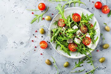 Healthy and tasty vegetarian salad with chia seeds arugula tomatoes cheese and olives on concrete background