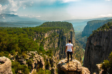 Man watching nature view. Magnificent view and majestic cliff of Tazi Canyon. View of the valley from above. Antalya, Turkey.