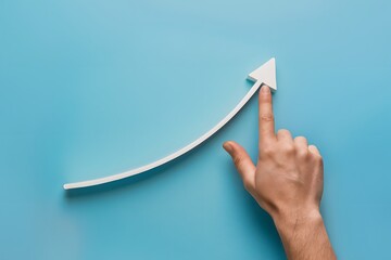 Hand points to rising curve on blue background capturing optimism and growth in minimalistic design